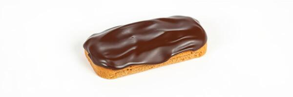 Delicious chocolate eclair with glossy glaze presented on a white surface ready for dessert lovers and pastry enthusiasts photo
