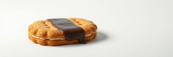 Delicious cookie with chocolate drizzle resting on a clean white surface photo