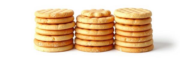 Stacks of round cookies arranged in a neat formation on a plain background photo