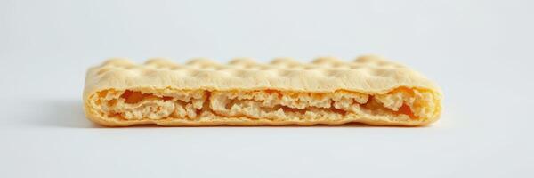 Wafers filled with creamy filling showcase a light golden color on a clean background photo
