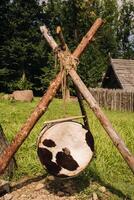 An old traditional drum with fur hanging in a medieval village photo