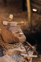 Forge, hammer on an anvil standing on the street photo
