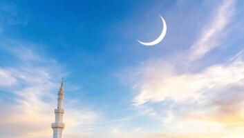 The crescent moon and the mosque in the background photo