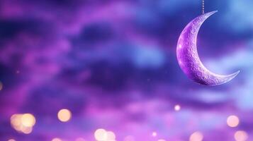 A purple crescent hanging from a string photo