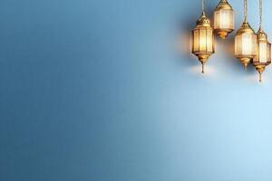 Three lamps hanging from the ceiling in front of a blue wall photo