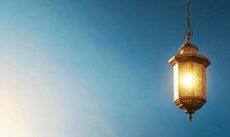 A lamp hanging from a ceiling with a blue sky in the background photo