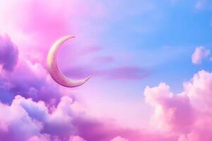 A crescent moon in the sky with clouds photo