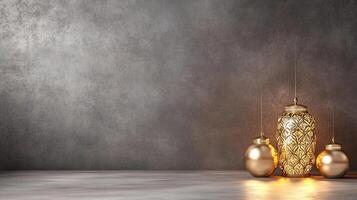 Three golden lamps on a table against a wall photo