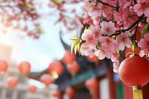 Chinese lanterns hanging from a tree with cherry blossoms photo