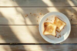 A plate with toast on it sitting on a table photo