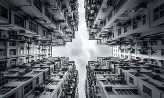 A black and white photo of a building with a sky in the middle