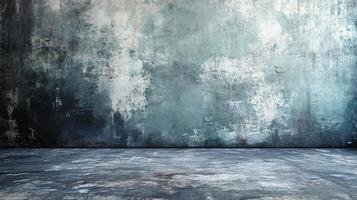 Large, empty room with a grey wall and a grey floor. The room is bare and empty, with no furniture or decorations. The grey color of the wall and floor creates a sense of emptiness and coldness photo