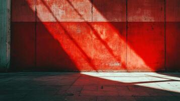 Red wall with a white stripe and a window. The wall is empty and the window is letting in sunlight photo