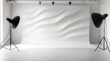 White wall with two black lights on either side of it. The wall is empty and the lights are turned on photo