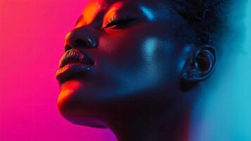 Woman with a glowing face is the main focus of the image. The colors of the background are purple and blue, creating a vibrant and eye-catching atmosphere photo
