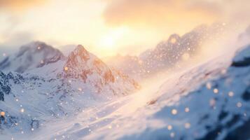 Mountain range with snow and a sun in the sky. The sun is setting and the sky is orange photo