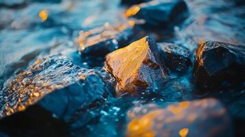 Rock is floating in the water. The water is blue and the rock is black. The rock is surrounded by water and it is not touching the bottom photo