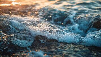 The water is shimmering with sunlight, creating a beautiful and tranquil scene. The waves are gentle and the water is calm, reflecting the bright colors of the sky photo