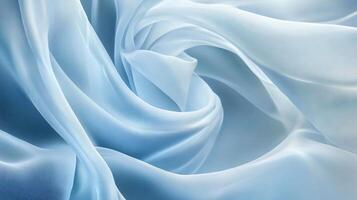 Blue fabric with a pattern of lines and swirls. The fabric is very soft and smooth to the touch photo
