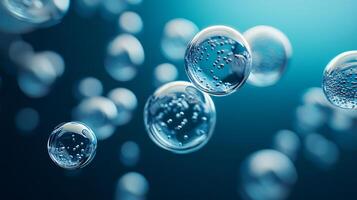 Series of bubbles floating in the air, each one filled with water. The bubbles are all different sizes and shapes, but they all have the same clear, sparkling appearance photo