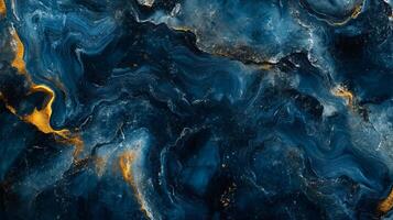 Blue and gold swirl. The blue and gold colors create a sense of depth and movement, while the swirls add texture and interest to the piece. The overall mood of the painting is serene and calming photo