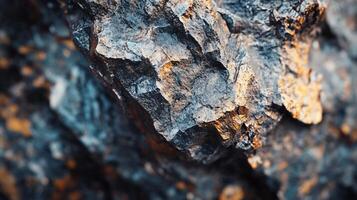 Rock with a blue and gold color. The rock is rough and has a lot of texture photo