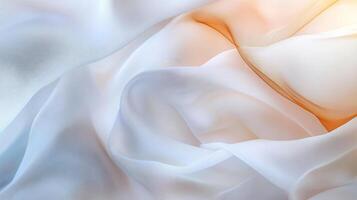 White fabric with a pattern of orange and white stripes. The fabric is folded and has a rough texture photo