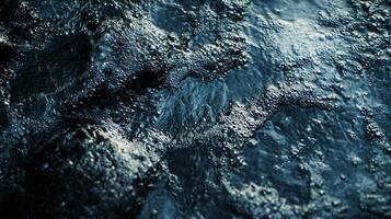 The image is of a body of water with a rocky bottom. The water is choppy and the rocks are scattered throughout the scene. Scene is calm and serene, with the water photo