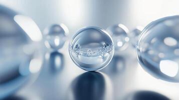 Close up of a clear sphere with a blue background. The sphere is surrounded by other spheres of varying sizes. Concept of depth and dimension, as the spheres appear to be floating in space photo