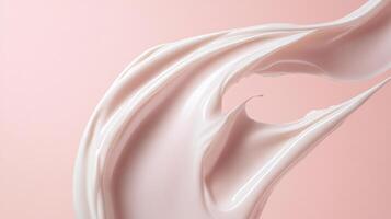 Creamy white liquid is flowing down a pink background. Concept of movement and fluidity, as if the cream is being poured or splashed onto the surface. The pink background adds a touch of color photo