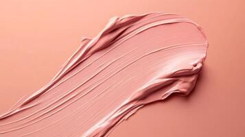 Pink lip gloss is applied to a woman's lips. The lip gloss is in a tube and is being applied in a smooth, even motion. Concept of beauty and self-care photo