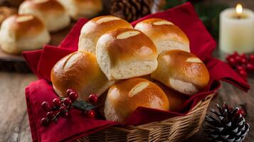 A basket of rolls with a candle and red napkin photo