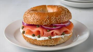 A bagel with salmon, onions and cream cheese photo