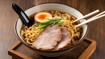 A bowl of ramen with meat and an egg photo