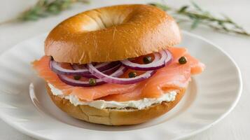 A bagel with onions and salmon on it photo