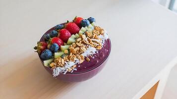 A bowl of fruit and nuts on a table photo