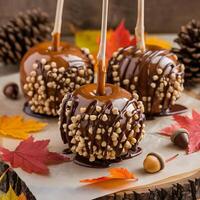 Caramel apples with nuts and drizzle on top photo