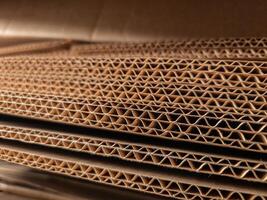 Close-up view of stacked corrugated cardboard layers, showcasing the intricate wave structure and texture, ideal for concepts like packaging, recycling, industry, and material design photo