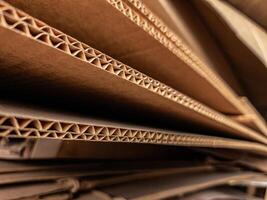 Close-up view of stacked corrugated cardboard layers, showcasing the intricate wave structure and texture, ideal for concepts like packaging, recycling, industry, and material design photo