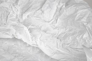 Crumpled white paper texture, abstract background. photo