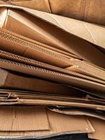 Close-up view of stacked corrugated cardboard layers, showcasing the intricate wave structure and texture, ideal for concepts like packaging, recycling, industry, and material design photo