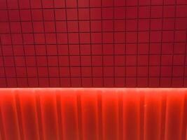 Red concrete wall and Lighting Effect. texture background, Red wall for design art work vintage style. photo