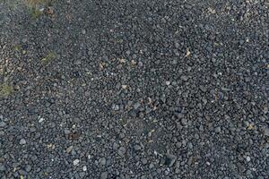 Pile of grey crushed stone. Abstract background and texture for design. photo