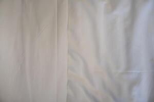 Background and textured of Overlapping white floor tiles in the middle. Use for blankets or pillowcases. photo