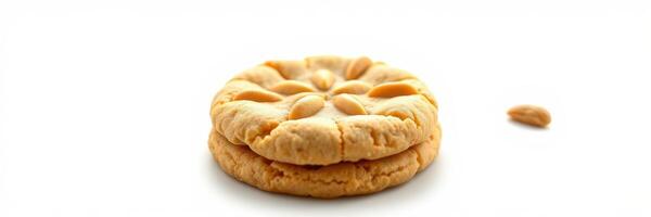 Deliciously intricate butter cookie resting on a white surface with a delicate design and one cookie fragment nearby photo