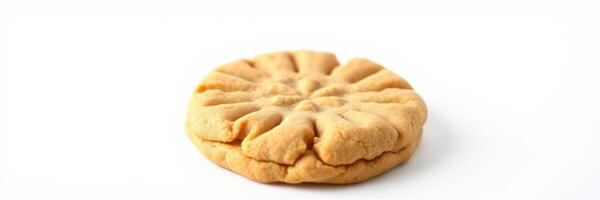 Freshly baked peanut butter cookie with a unique design resting on a clean surface photo