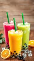 Colorful tropical drinks served with ice and fruit on wooden table photo