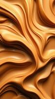 Wavy patterns of smooth caramel-colored substance create an intriguing visual texture photo