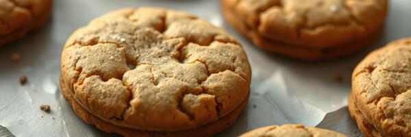 Delicious homemade cookies cooling on parchment paper in a cozy kitchen environment photo