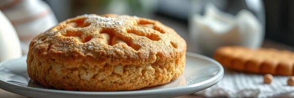 Delicious pastry with decorative pattern on a plate set in a cozy kitchen environment photo
